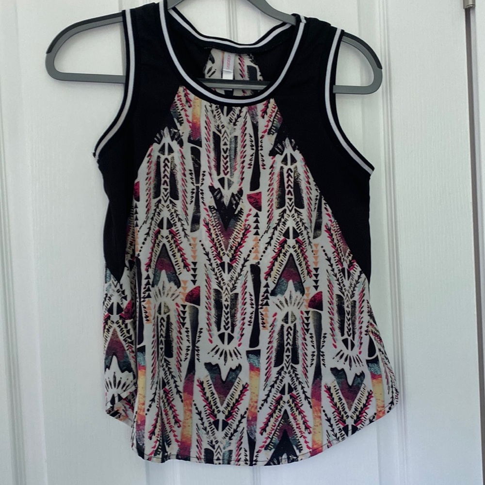 Printed tank with black and white lined neck and arms.